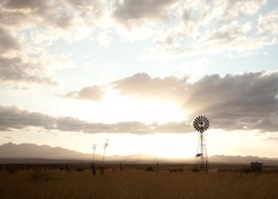 Traditional Windmill silhouetted against an evening sky