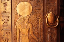 Ancient egypt scene. Hieroglyphic carvings on the exterior walls of an ancient egyptian temple
