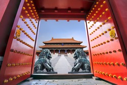 Red entrance gate opening to the forbidden city in Beijing - China