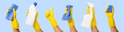 hand with yellow rubber glove holding cleaning supplies isolated on blue background. banner
