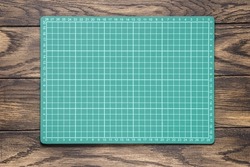 Creative grids cutting mat on table top view with copy space