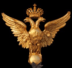 Arms of the Russian Federation isolated on a black background. This eagle is established on Hermitage collars