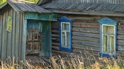 A windows and porch in a wooden house of the 19th-early 20th century. North Russian village
