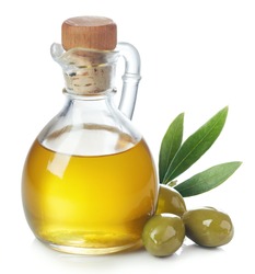 Bottle of fresh extra virgin olive oil and green olives with leaves isolated on white background