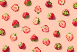 Colorful pattern of strawberries on pink background. Top view
