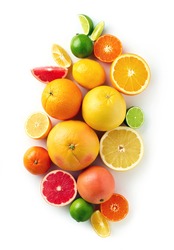 Creative composition of colorful citrus fruits isolated on white background, top view, flat lay
