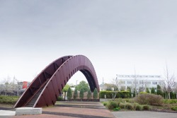 The Piety Street pedestrian bridge known as the Rusty Rainbow in New Orleans Crescent Park                            