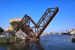 An aging railroad draw bridge over the Rouge River, south of Detroit, Michigan, with an enormous counterweight.