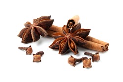 Cloves, anise and cinnamon isolated on white background. Shallow dof