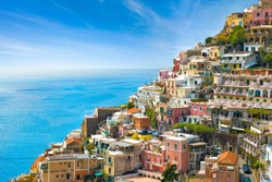 Beautiful Positano with hotels on hills leading down to coast, comfortable beaches and azure sea on Amalfi Coast in Campania, Italy. Amalfi coast is popular travel and holyday destination in Europe.