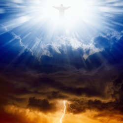 Jesus Christ in blue sky with clouds, bright light from heaven, heaven and hell