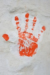It is believed in India that such hand symbols on walls protection from demons and sorcerers. It has got it's own spiritual importance.