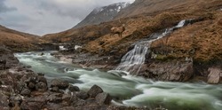 Composite image of red deer stag in Beautiful Winter landscape image of River Etive and Skyfall Etive Waterfalls in Scottish Highlands