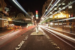 traffic lights in the center of London at night
