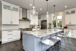 Beautiful kitchen in luxury contemporary home modern interior with island and stainless steel chairs