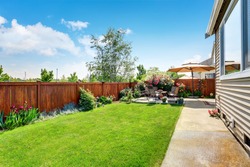 Beautiful landscape design for backyard garden and patio area on concrete floor. Northwest, USA
