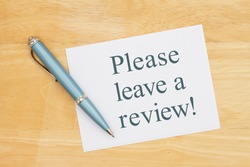 Please leave a review card with a pen on a desk