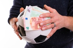 male hands with soccer- ball and money