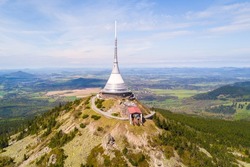 Aerial view of Jested tower with cable car on the top of Jested mountain 1 012 m (3,320 ft). Famous tourist attraction near Liberec in Czech republic, Europe. 