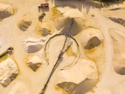 Aerial view of sandpit and factory plant producing sand materials for construction industry. Top view of large manufacturing plant in landscape. Halamky near Trebon, Czech republic, European union.