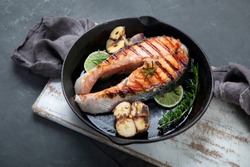 Salmon steak in a grill pan. Balanced diet. 