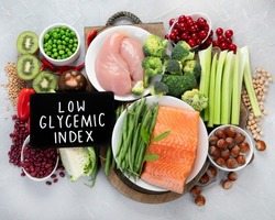 Foods with low glycemic index on gray background. Healthy food concept. Top view, flat lay