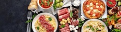 Italian food dishes on dark background. Traditional italian cuisine  concept. Dishes and appetizers. Mideterranean diet high in vitamin and antioxidants. Top view, copy space,panorama, banner