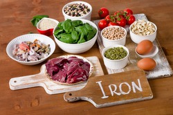 Foods high in Iron, including eggs, nuts, spinach, beans, seafood, liver, sesame, chickpeas, tomatoes. 