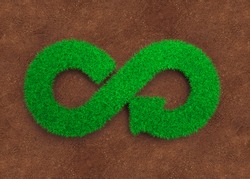 ECO and circular economy concept. The green grass in form of arrow infinity recycling symbol and red soil background.