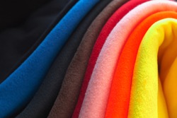 Colorful fleece. Background texture of soft napped insulating fabric made of polyester
