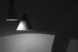 Abstract interior background, hanging spot lights and shadows in dark empty room