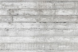 Rough white concrete wall background texture with imprint relief of wooden formwork