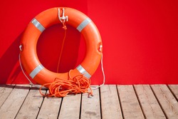 Lifebuoy stands on wooden floor of lifeguard station