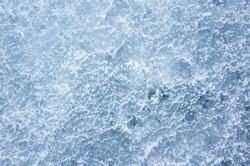 Ice texture, top view, natural background photo of frozen winter river ground