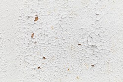 Rusted white metal wall with cracks on paint, background texture