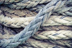 Gray nautical rope, closeup background texture, vintage toned photo with retro style filter