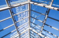 Abstract high-tech architecture background photo, internal structure of glass roof arch with lockable windows sections