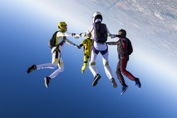 Group collects figure skydivers in freefall.