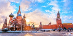 View of Kremlin and Cathedral of St. Basil at the Red Square at sunset winter in Moscow, Russia