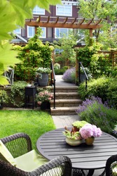 Small townhouse perennial summer garden. Also available in horizontal.
