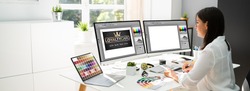 Graphic Designer Artist Working On Multiple Computer Screens