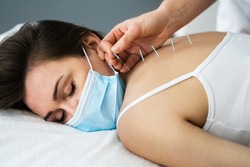 Acupuncture Massage Therapy Treatment In Face Mask