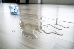 Water On House Floor Surface. Laminate Damage