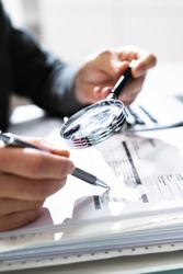 Businessman Finance Investigation Using Magnifying Glass. Fraud And Audit