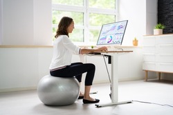 Correct Posture At Desk In Office Using Fitness Ball
