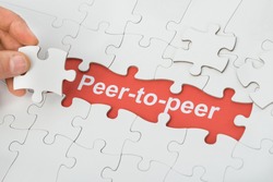 Person Holding Jigsaw Puzzle Piece With Peer-to-peer Text