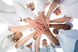 Low Angle View Of Smiling Medical Team Stacking Hands