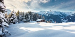 Winter panorama with ski hut in the snow