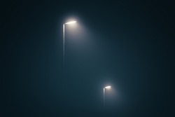 Street lights in the misty evening glowing in the dark by midnight
