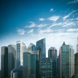 modern financial buildings against a blue sky in shanghai
